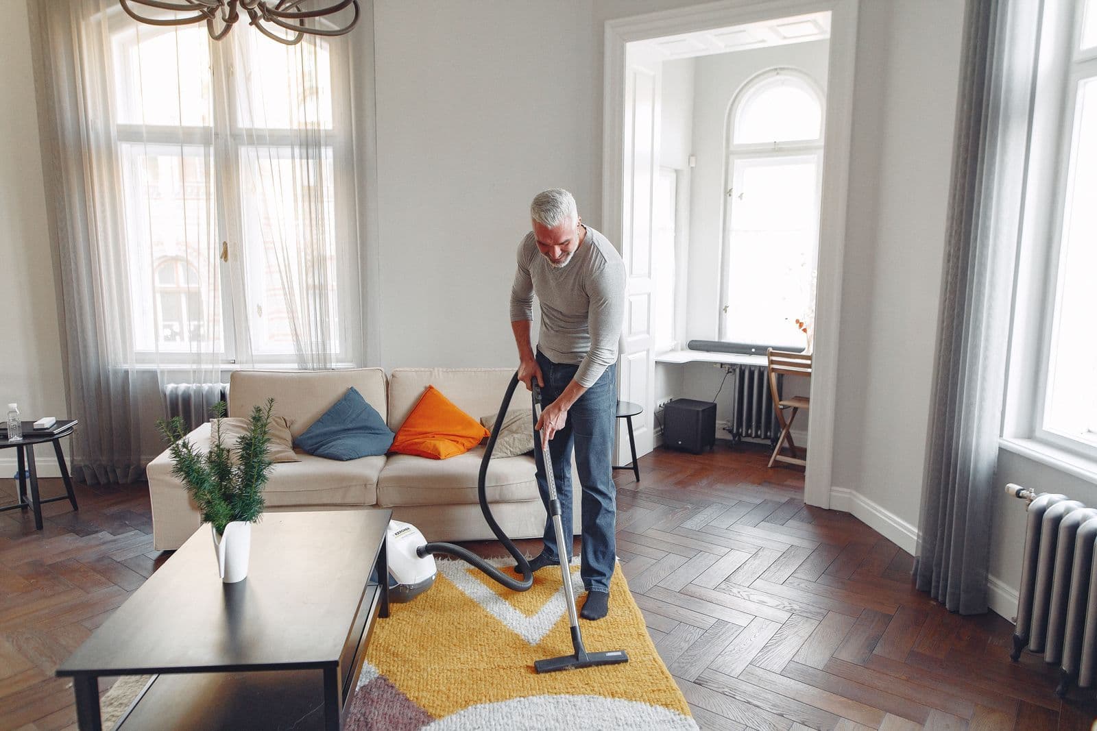 Living room carpet being vacuumed